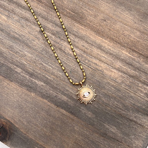 Gold plated sun and eye necklace