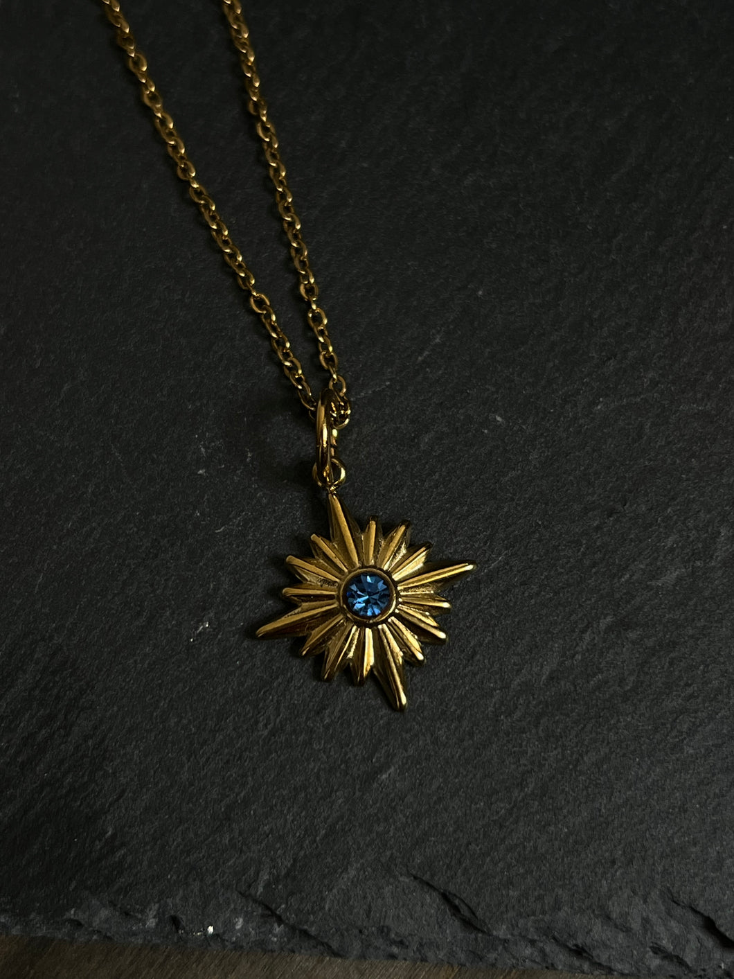 Star with blue stone necklace