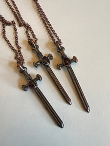 Copper garnet sword necklace
