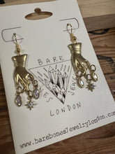 Load image into Gallery viewer, Hand and star earrings
