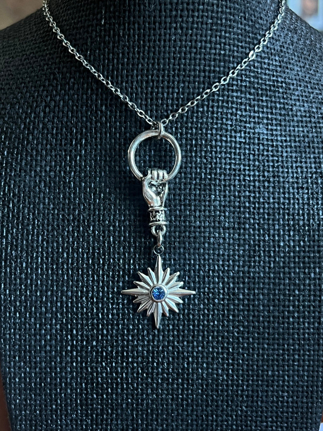 Star and hand with blue stone stainless steel necklace