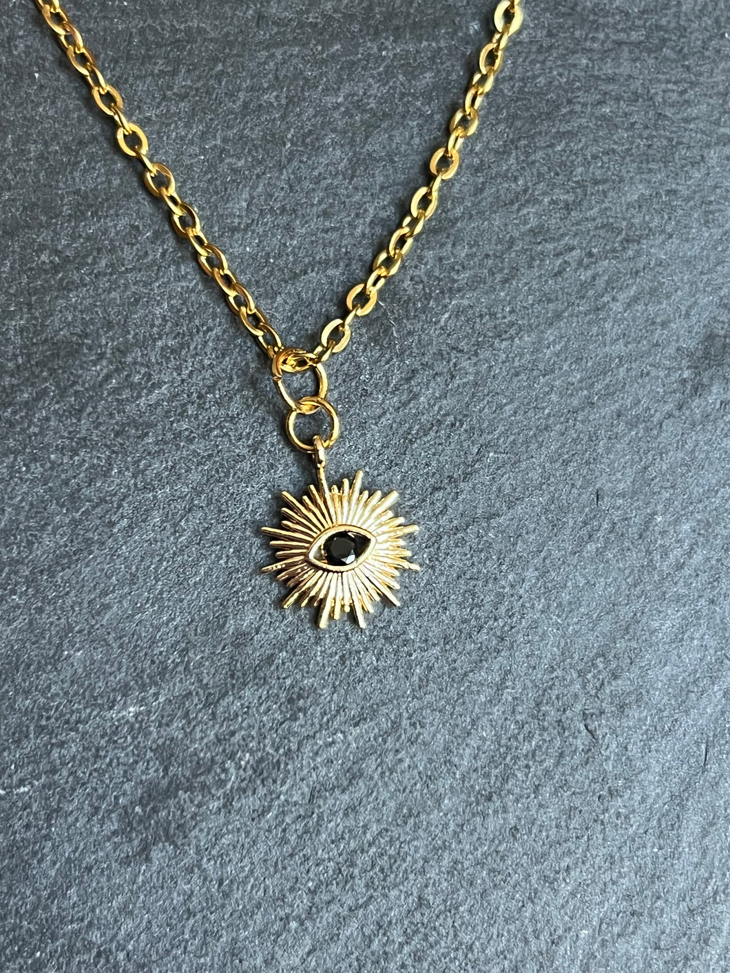 Gold plated Brass sun and black eye necklace