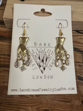 Load image into Gallery viewer, Hand and star earrings
