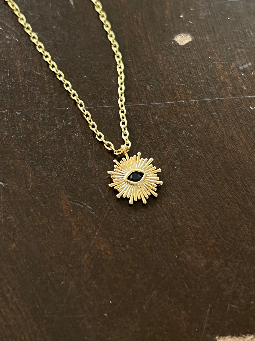 Gold plated Brass sun and black eye necklace