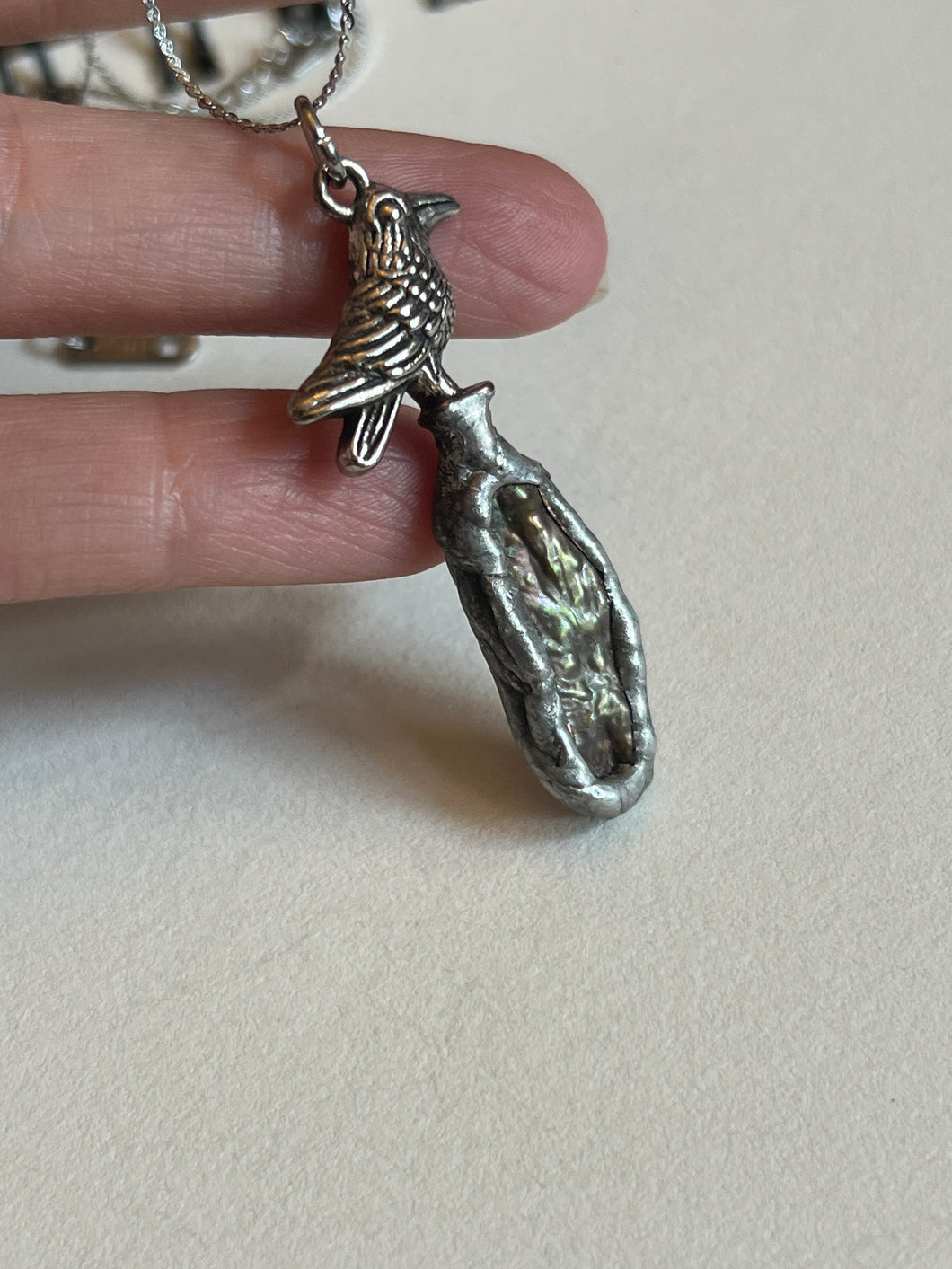 Pearl and bird necklace