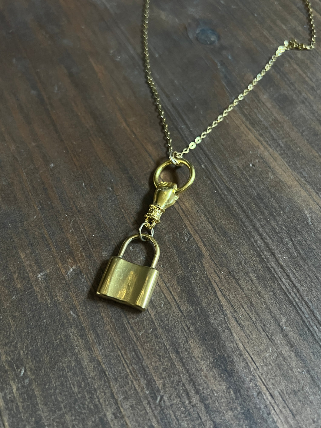 Large padlock and hand necklace