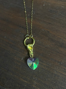 Iridescent heart and hand necklace ￼