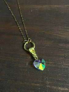Iridescent heart and hand necklace ￼