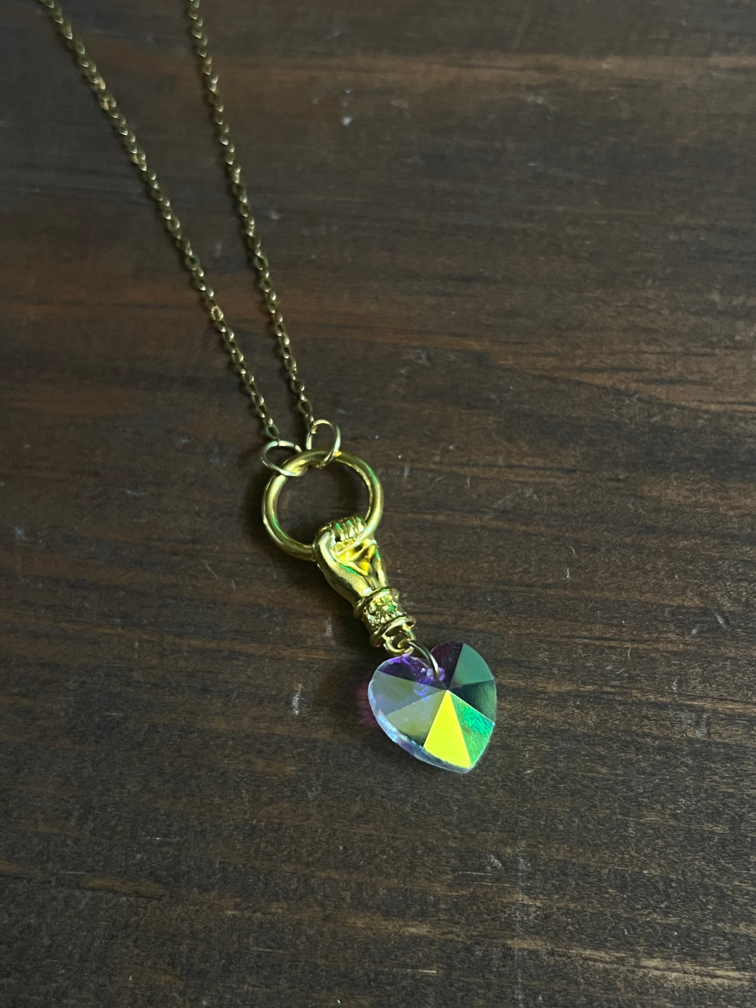Iridescent heart and hand necklace ￼