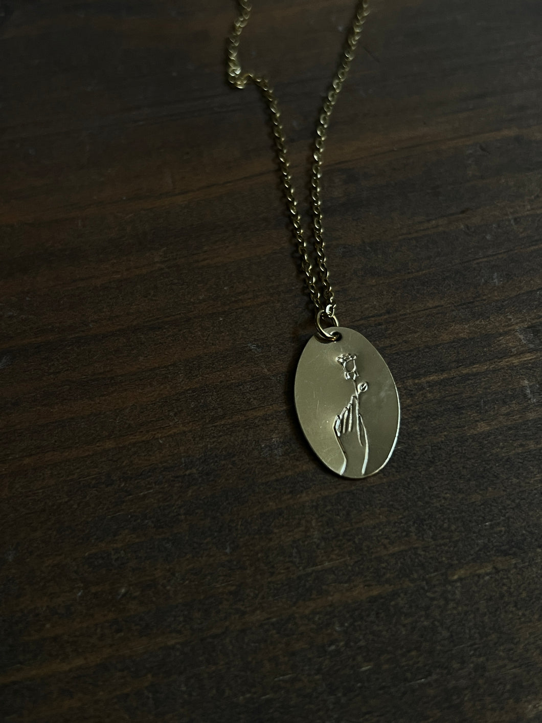 Hand and rose necklace