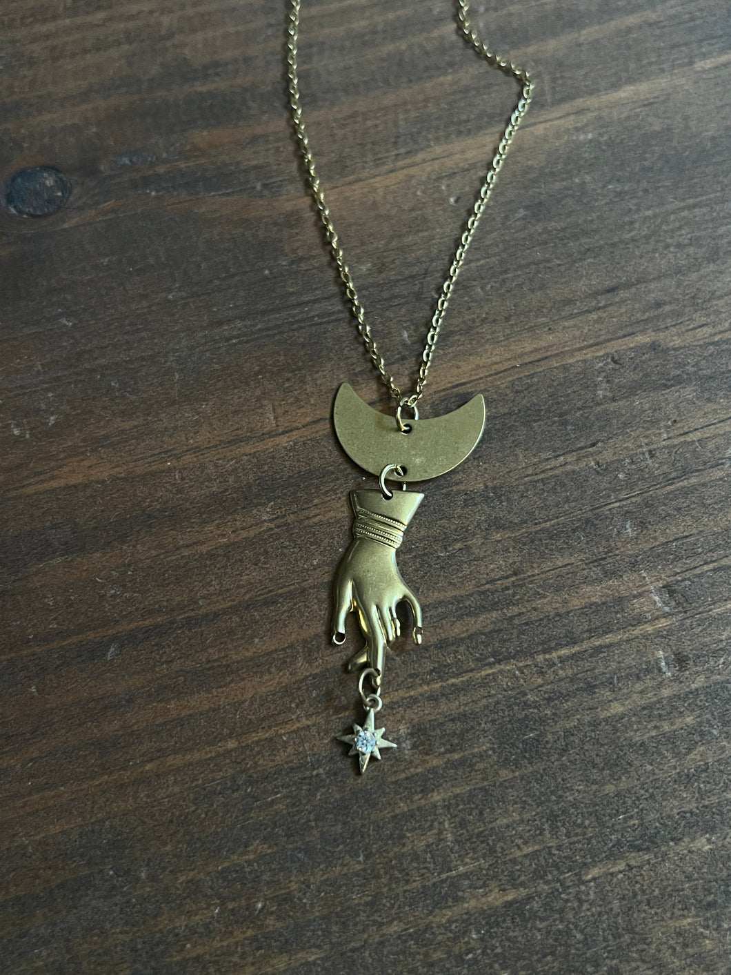 Hand and star necklace