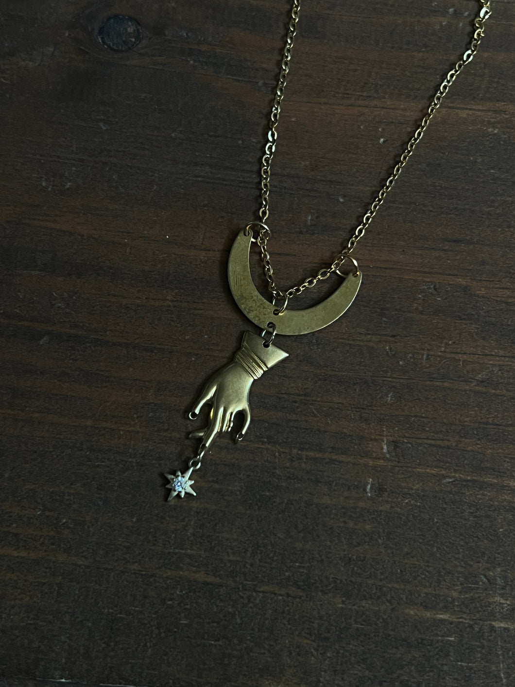 Hand and star necklace