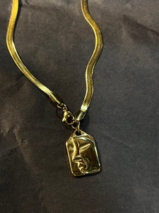 Face necklace